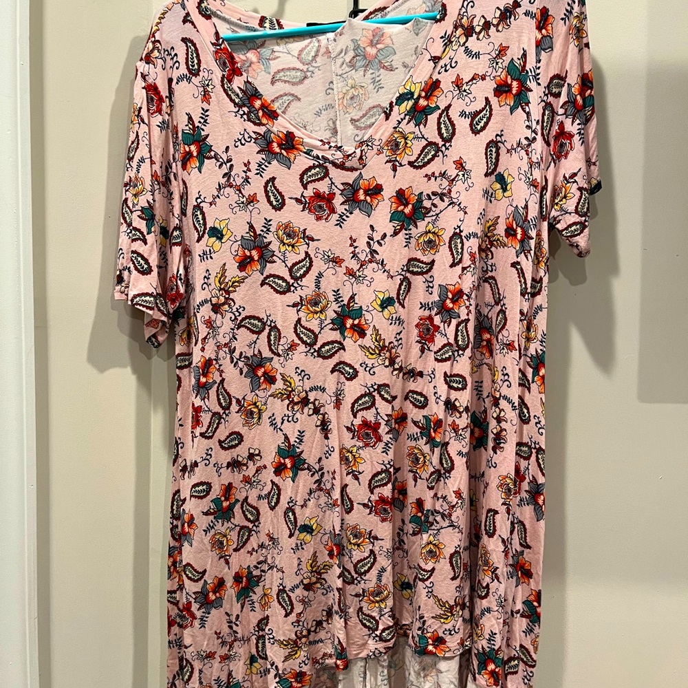 Blumin Floral Top with Pink Background.